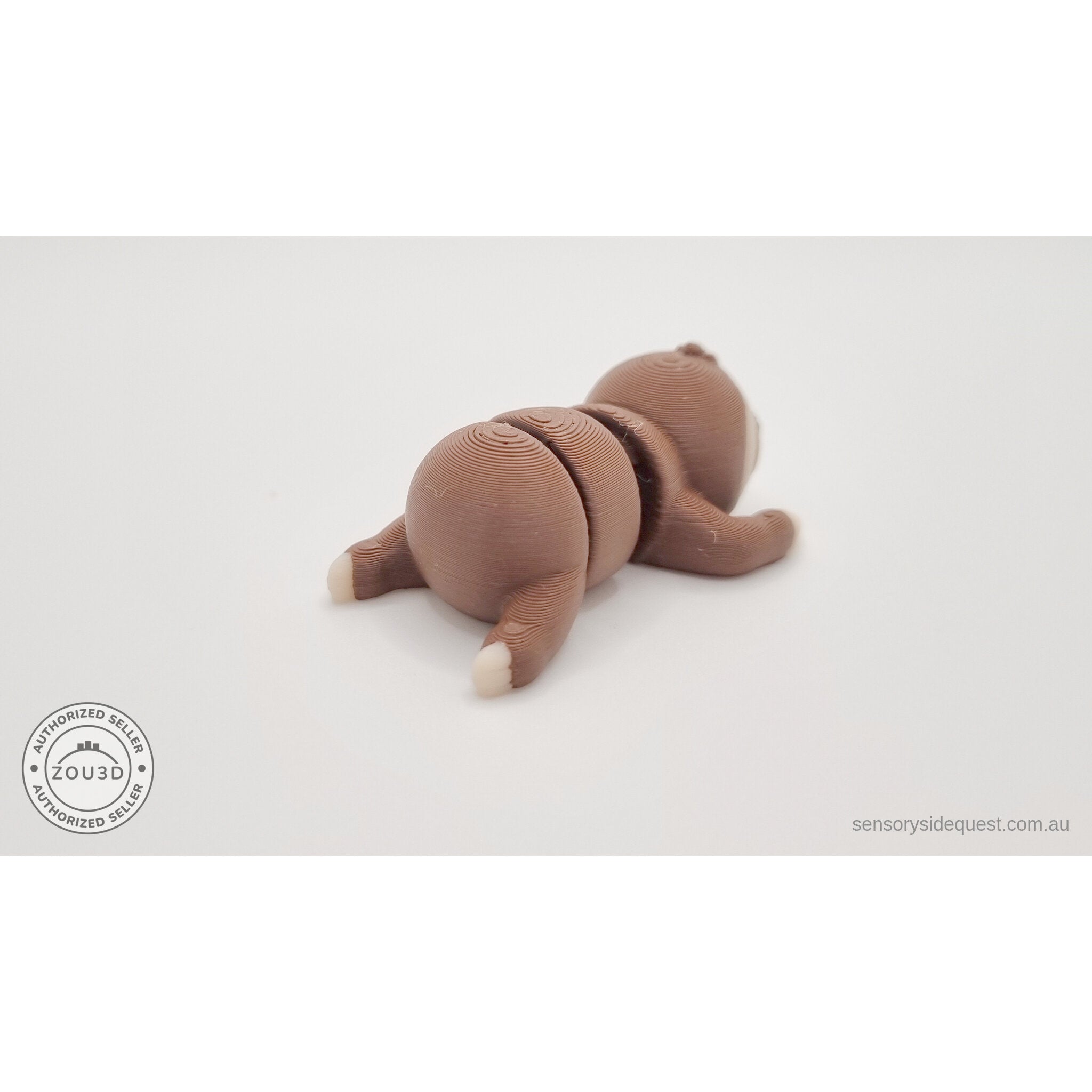 Baby Sloth articulated toy — rear 3/4 view showing body segments and extended arms, own photo by Sensory Sidequest