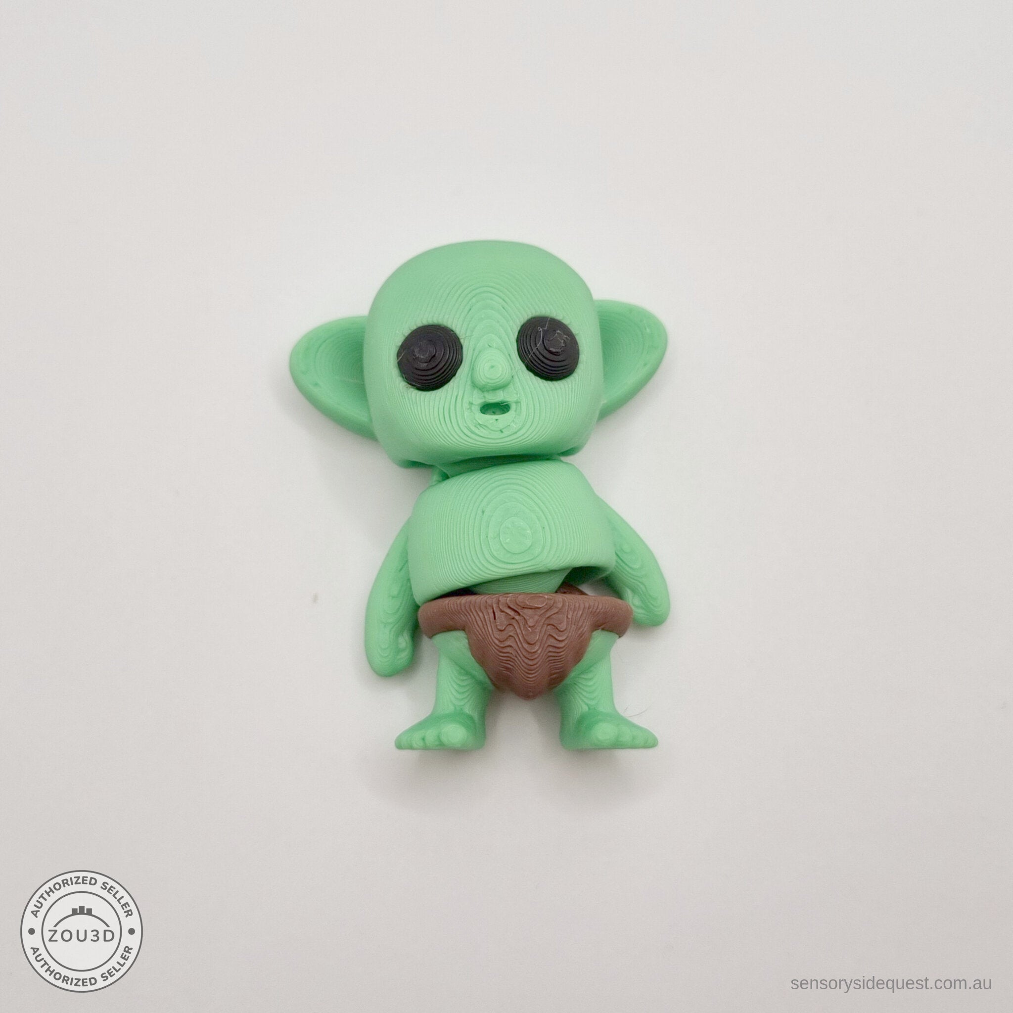 Green Tiny Goblin 3D printed articulated toy — front-facing overhead own photo