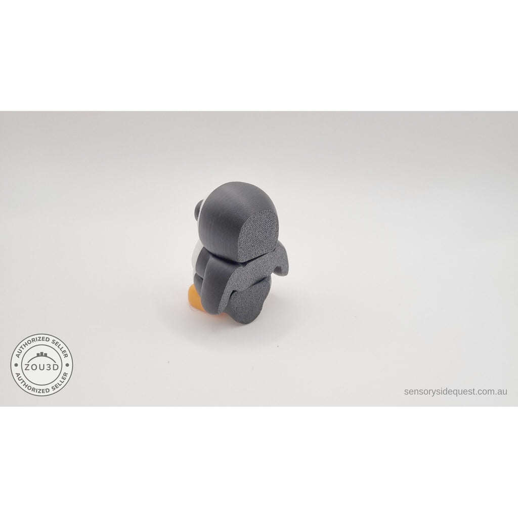 Penguin articulated fidget toy 3/4 left profile view standing, showing white front and black back with orange feet, white body with black and orange accents — 3D printed articulated fidget toy by Sensory Sidequest