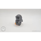Penguin articulated fidget toy 3/4 left profile view standing, showing white front and black back with orange feet, white body with black and orange accents — 3D printed articulated fidget toy by Sensory Sidequest