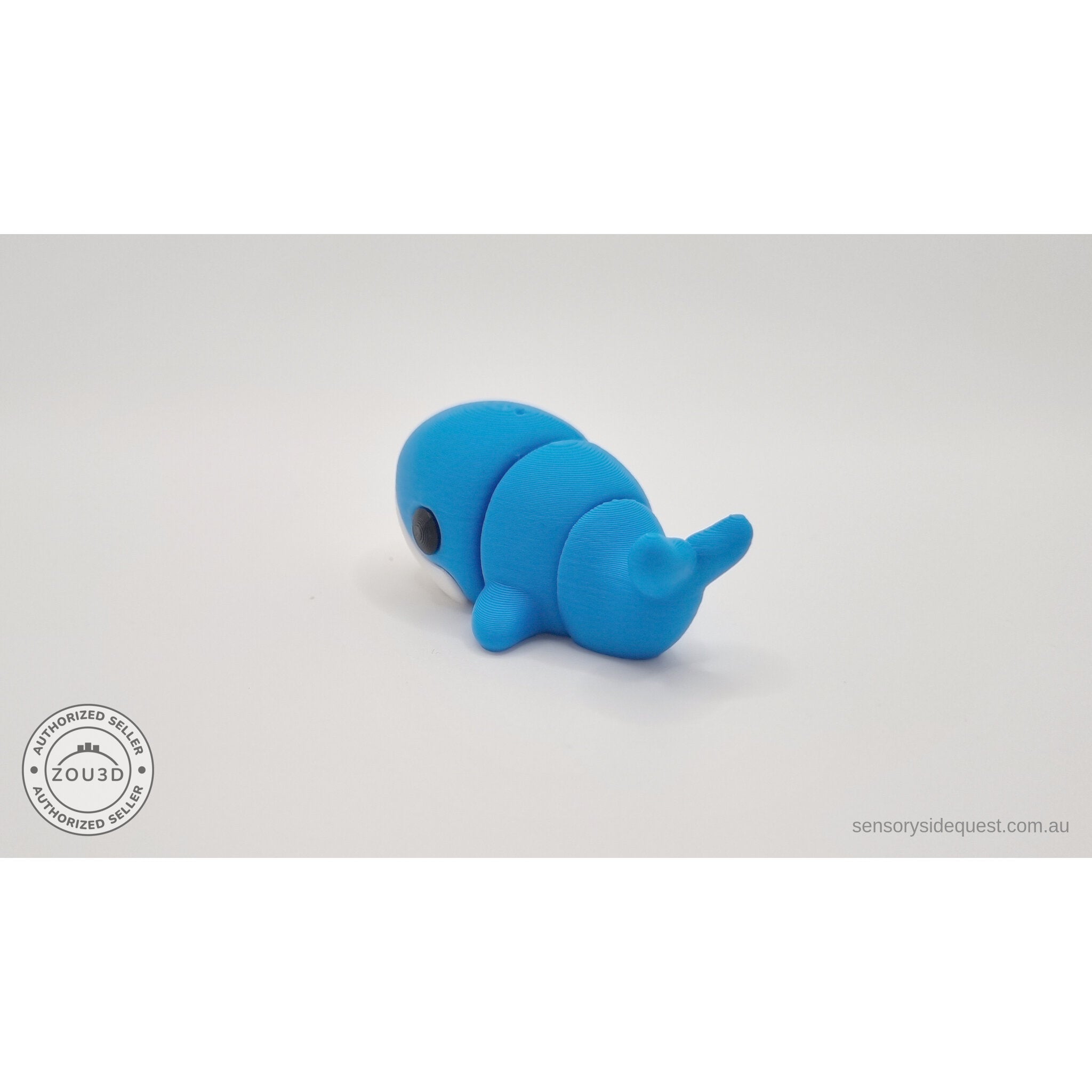 Baby Blue Whale 3D printed fidget toy — 3/4 right side view showing tail flukes and body segments, own photo by Sensory Sidequest