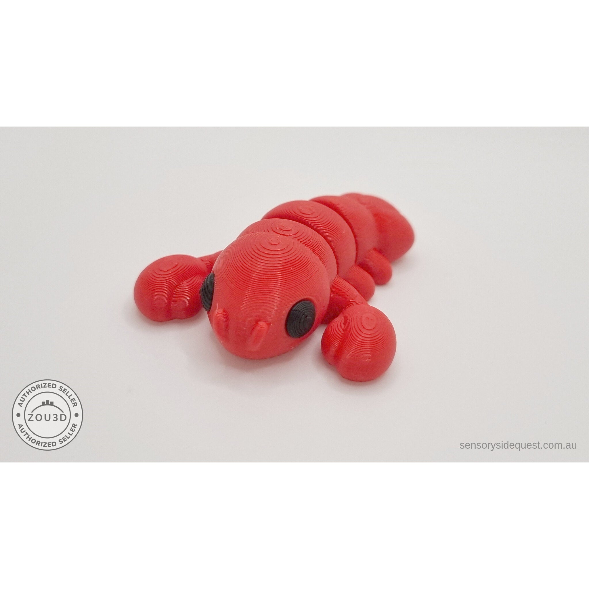 Baby Lobster 3D printed articulated fidget toy in red silk — front 3/4 hero view showing both matte black eyes and claws — Sensory Sidequest Australia