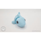 024-SHK Baby Shark in ice blue matte, 3/4 rear/curled view showing tail segments — 3D printed articulated fidget toy by Sensory Sidequest