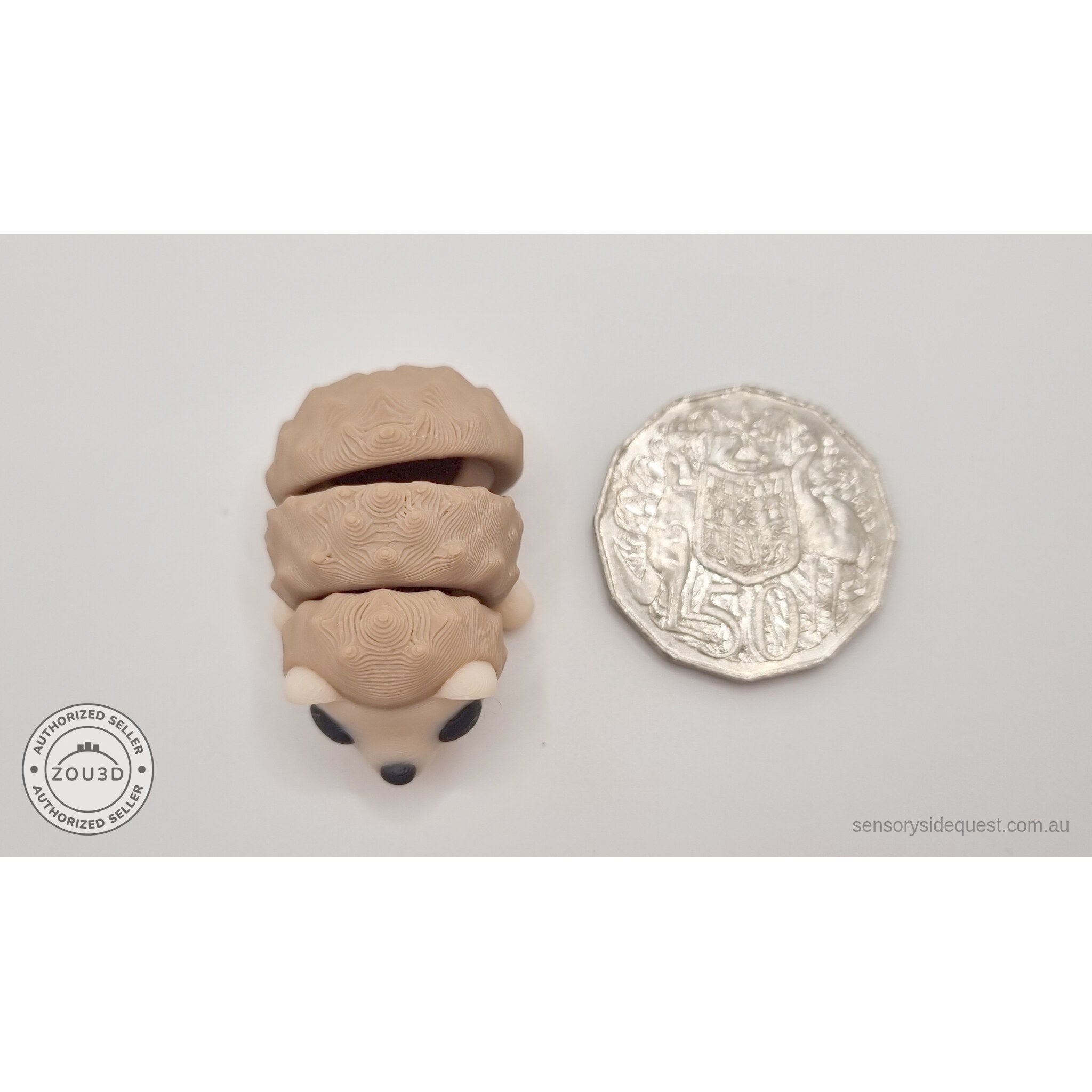 Baby Hedgehog 3D printed articulated toy next to Australian 50c coin for size reference — own photo by Sensory Sidequest