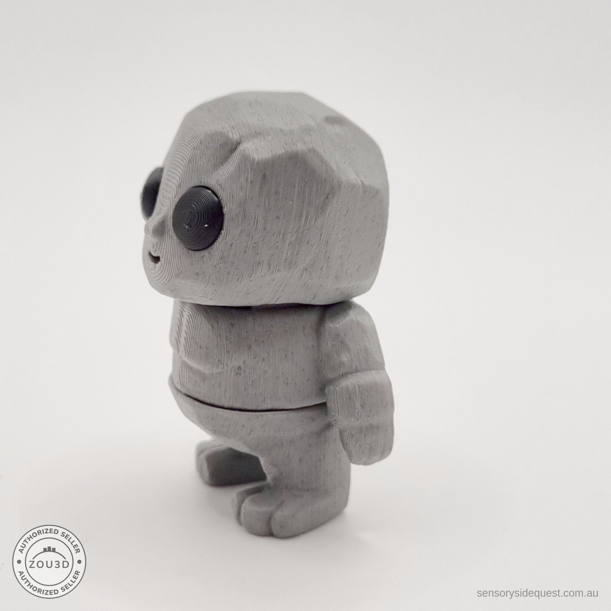 Grey Tiny Rock Golem 3D printed articulated fidget toy — side view by Sensory Sidequest