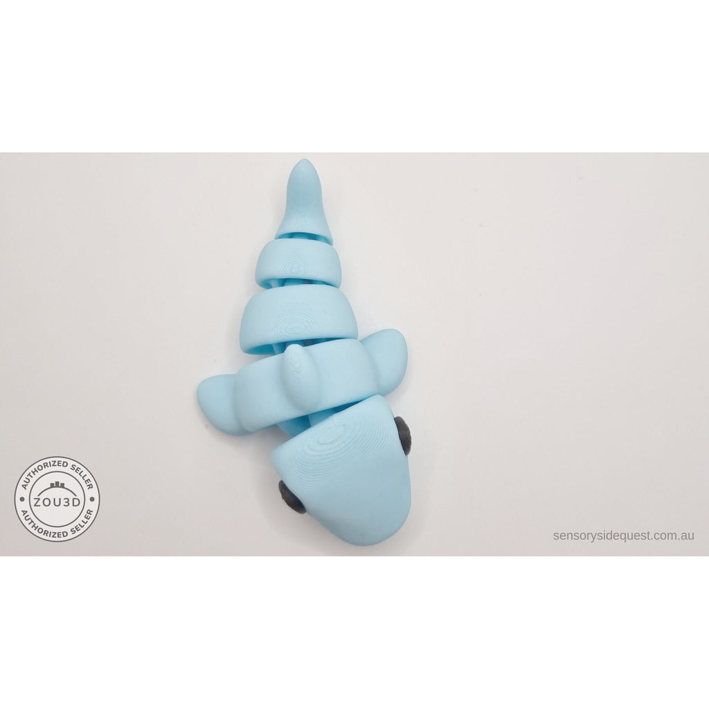 024-SHK Baby Shark in ice blue matte, upright vertical twisted pose showing full flex range — 3D printed fidget toy by Sensory Sidequest