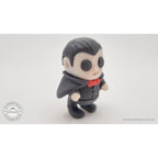 Tiny Dracula 3D printed articulated fidget toy — 3/4 right view showing cape and red bow tie accent, own photo by Sensory Sidequest