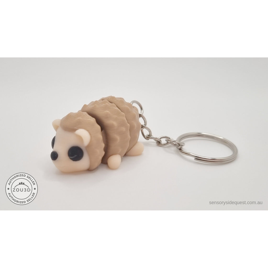 Baby Hedgehog articulated fidget toy with keychain — 3/4 front view showing full figure and key ring, own photo by Sensory Sidequest