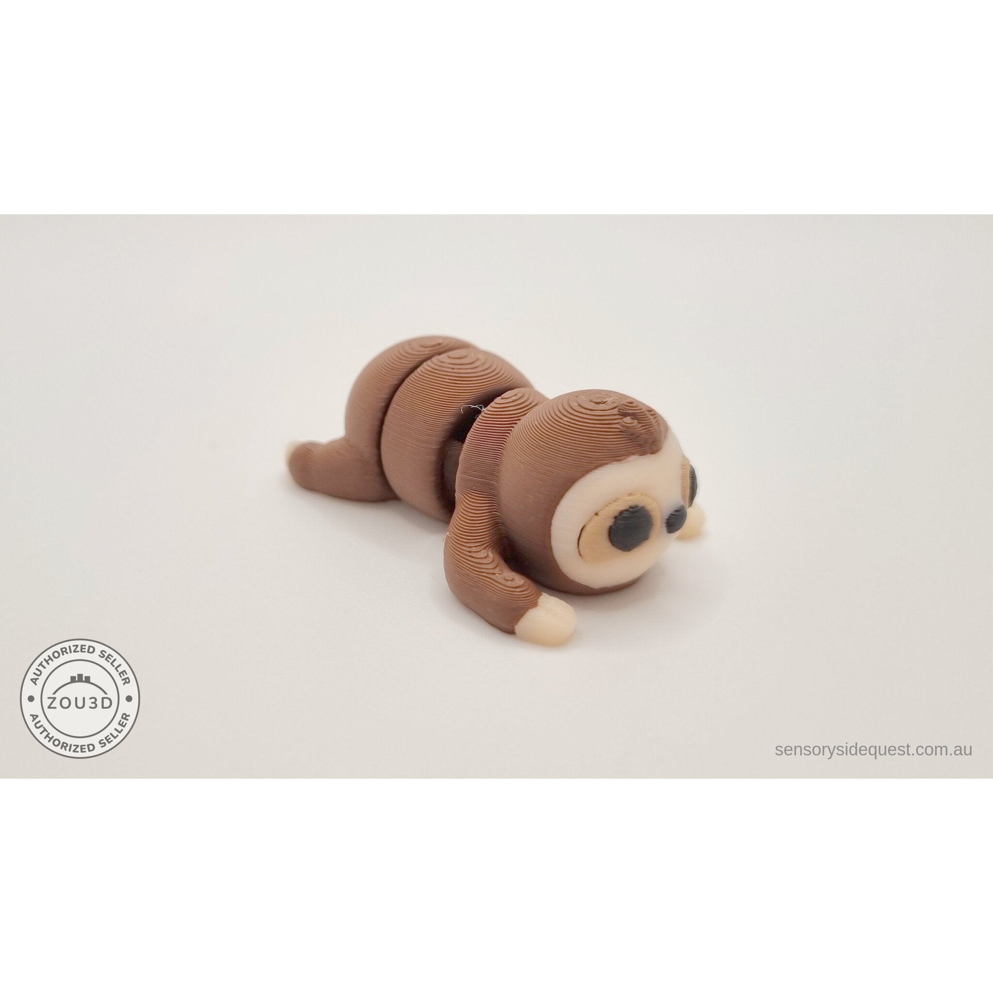 Baby Sloth 3D printed articulated fidget toy — front low angle showing face and paw tips, own photo by Sensory Sidequest