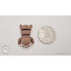 Baby Sloth articulated fidget toy next to Australian 50c coin for size reference — own photo by Sensory Sidequest