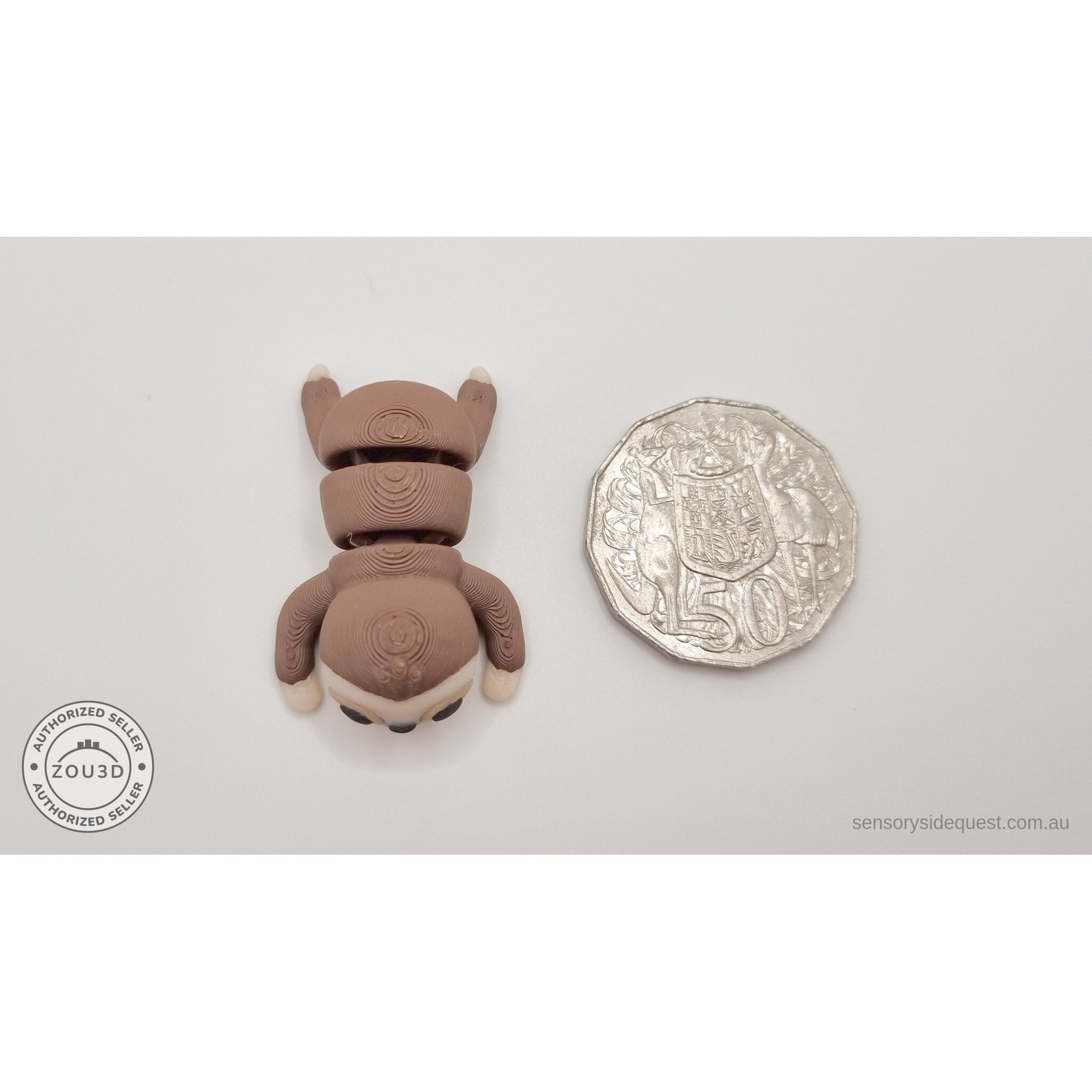 Baby Sloth articulated fidget toy next to Australian 50c coin for size reference — own photo by Sensory Sidequest
