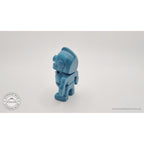 3D printed Tiny Robot articulated fidget toy in teal — rear-left view showing back panel and body segments — Sensory Sidequest
