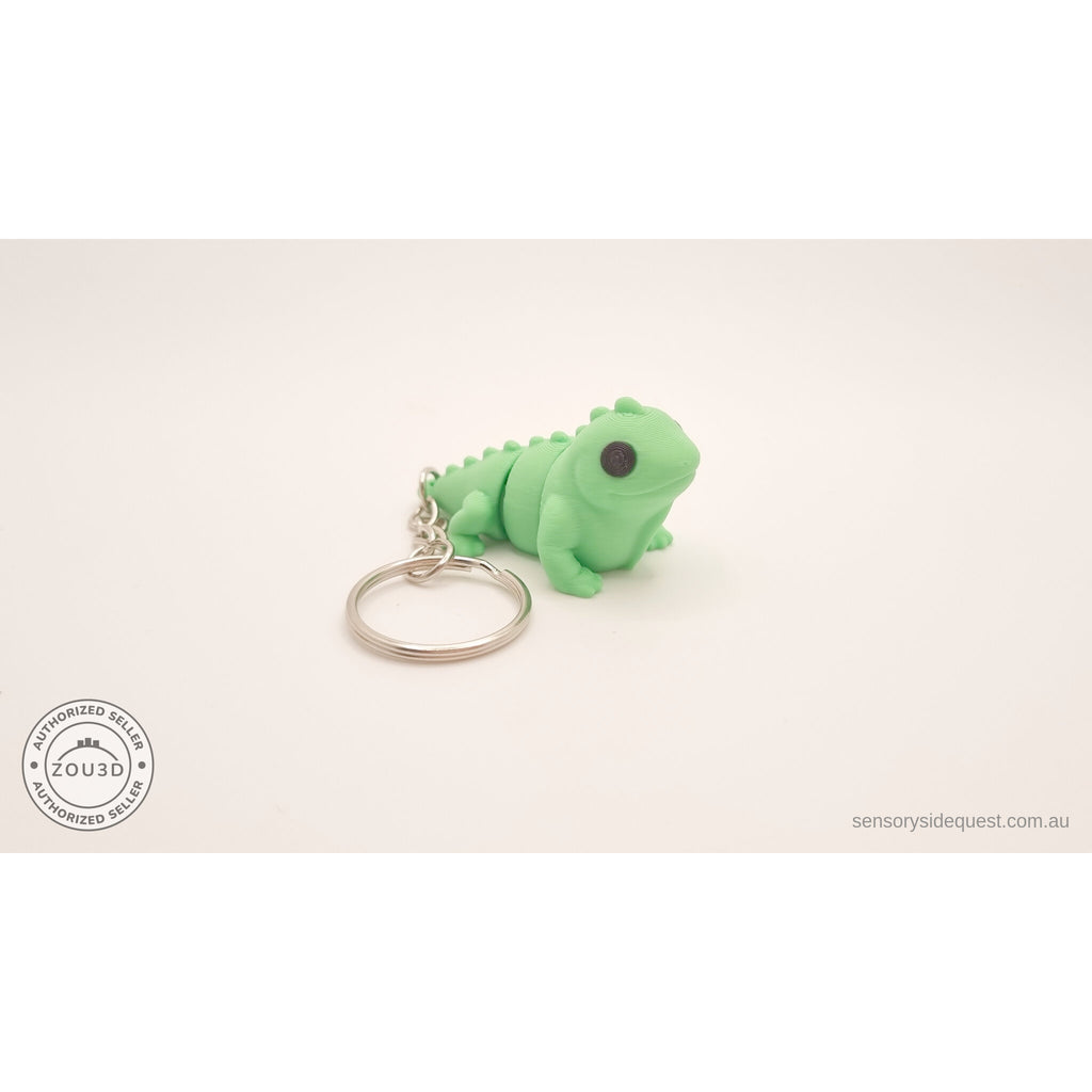 Green Baby Iguana keychain — 3/4 front-left view showing face and keyring by Sensory Sidequest