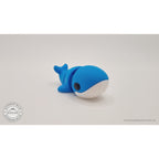 Baby Blue Whale 3D printed fidget toy — rear overhead angle showing dorsal surface and tail flukes, own photo by Sensory Sidequest