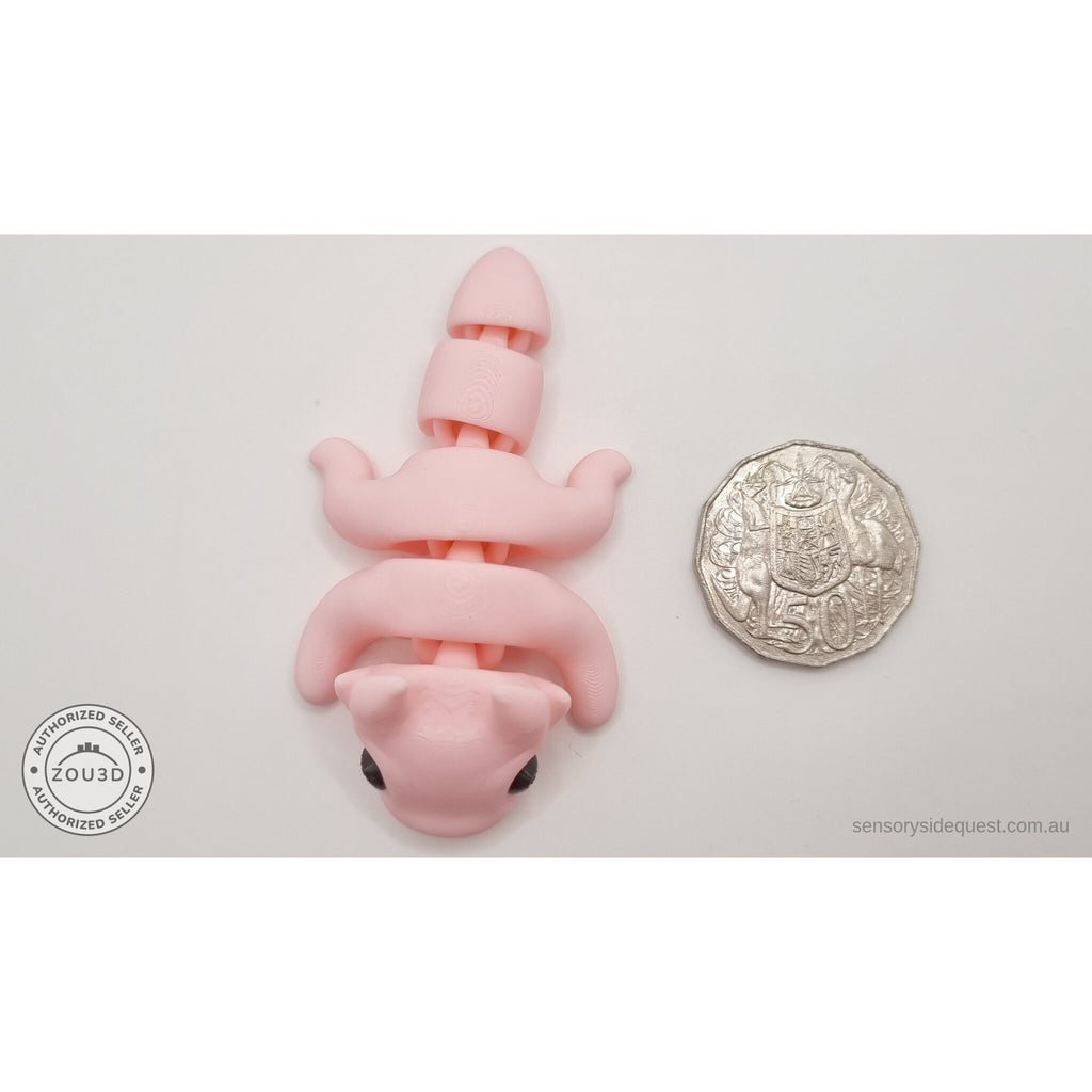 Pink Tiny Dragon size comparison with Australian 50 cent coin — palm-sized articulated fidget toy by Sensory Sidequest