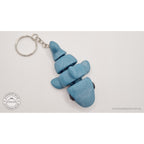027-TNYSHK Tiny Shark keychain in gentian blue — upright dangling view showing all body segments stacked vertically with keychain ring at top — 3D printed articulated fidget toy by Sensory Sidequest