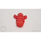 Baby Lobster 3D printed fidget toy in red silk — rear angle from above showing claws spread wide and tail fan segments