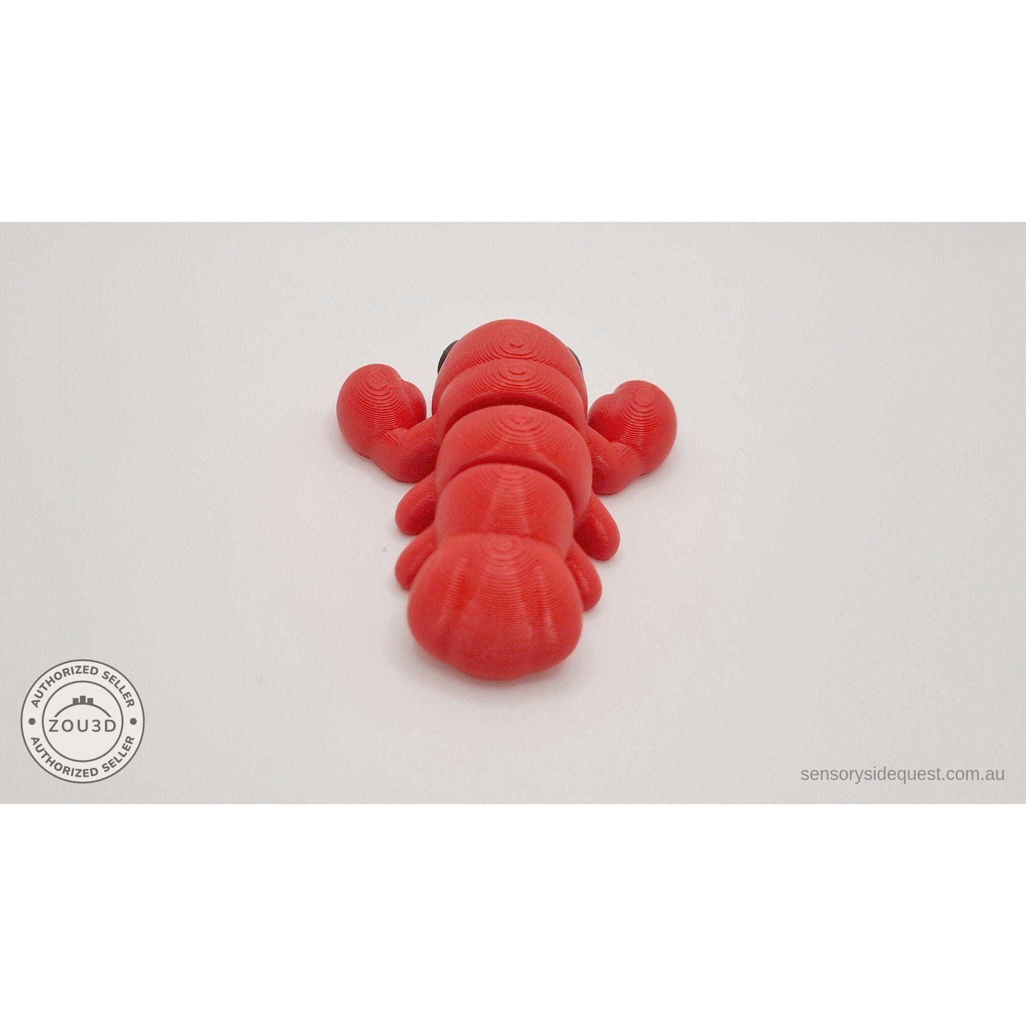 Baby Lobster 3D printed fidget toy in red silk — rear angle from above showing claws spread wide and tail fan segments