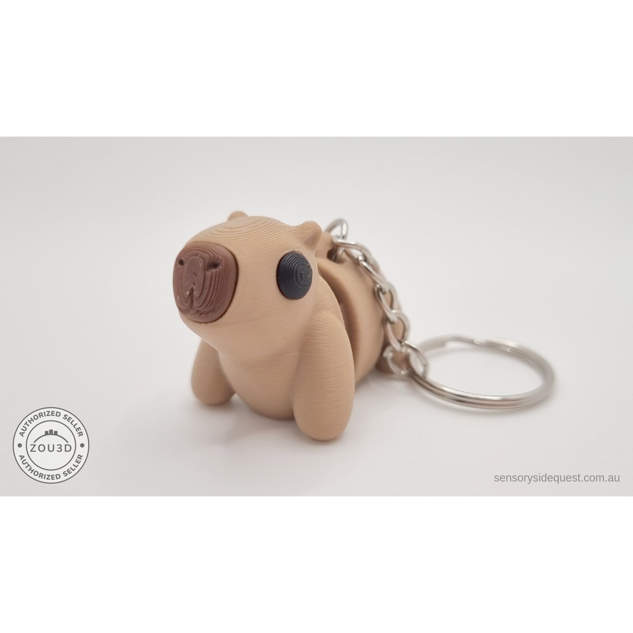 Baby Capybara smooth keychain — three-quarter front view with ring and chain hardware