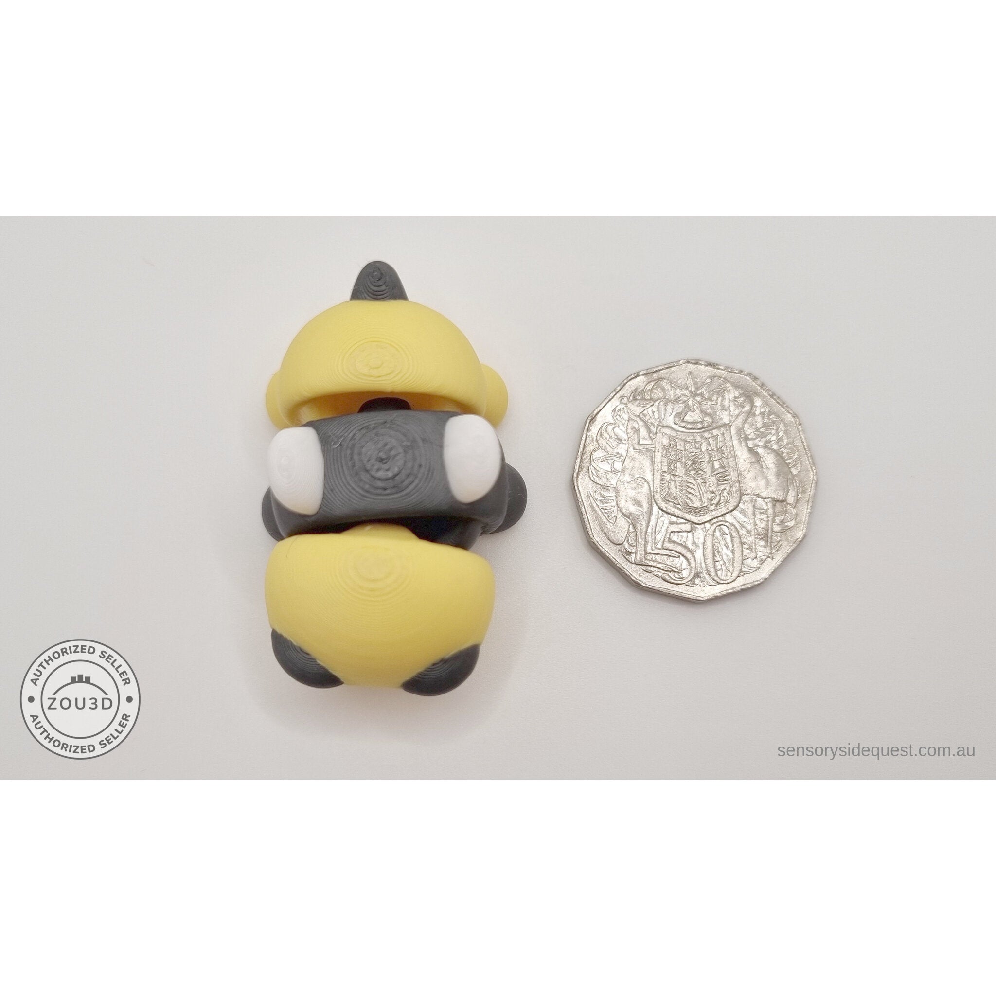 Baby Bee beside Australian 50 cent coin — scale reference showing compact pocket size