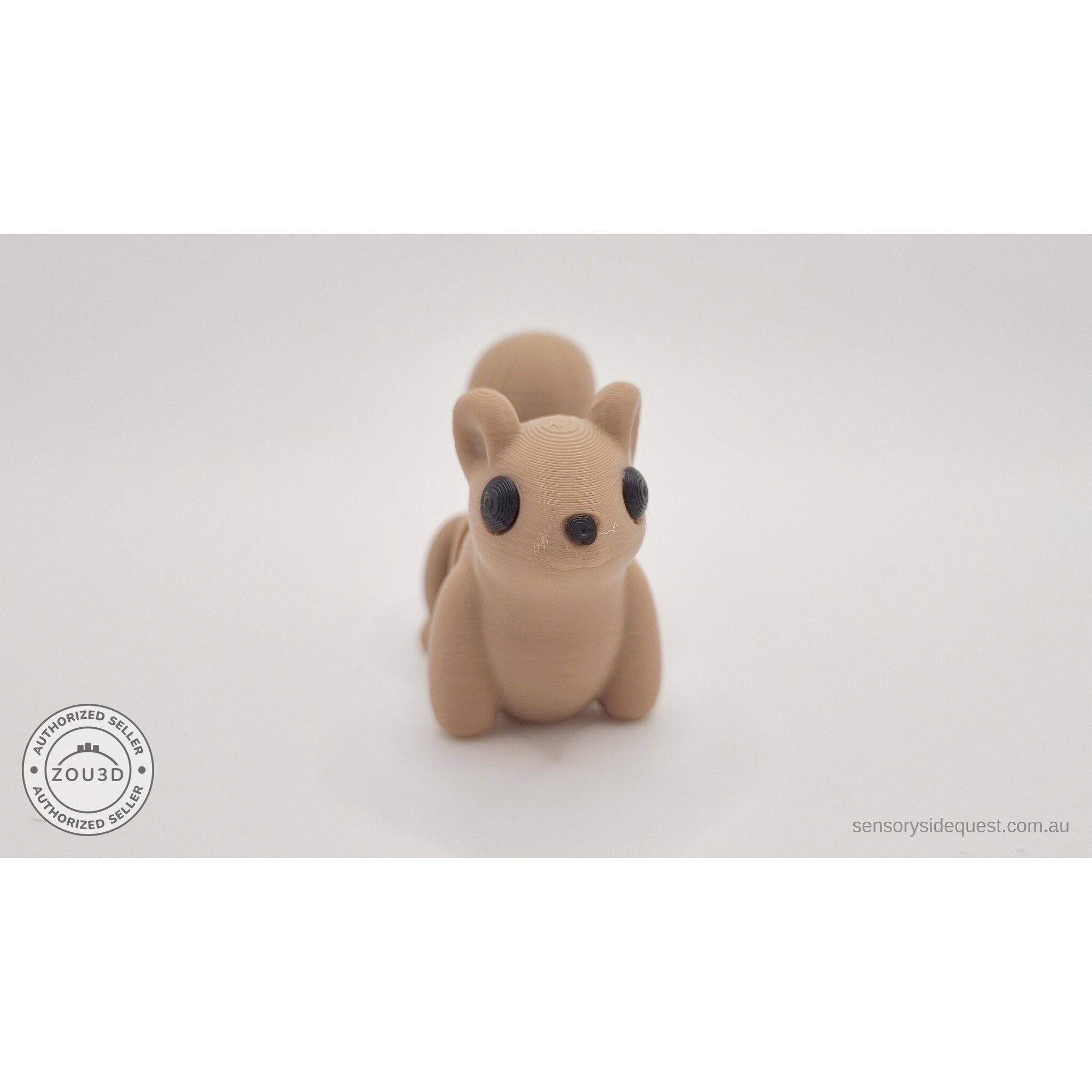 Baby Squirrel Zou3D 3D printed articulated fidget toy — straight front face view showing large black eyes, paws, and arching tail overhead — Sensory Sidequest Australia